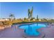 Relaxing kidney-shaped pool with patio and lounge chairs at 6358 Granger Rd, Port Charlotte, FL 33981