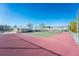 Well maintained community tennis court with surrounding landscape at 6600 Gasparilla Pines Blvd # 210, Englewood, FL 34224