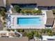 Directly above view of community pool and patio at 6796 Gasparilla Pines Blvd # 7, Englewood, FL 34224