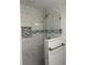 Modern shower with glass enclosure and gray marble tile at 7320 Freeberg Cir, Port Charlotte, FL 33981