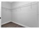 Spacious walk-in closet with wire shelving and gray walls, providing ample storage at 7320 Freeberg Cir, Port Charlotte, FL 33981