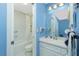 Clean bathroom with white vanity, toilet and shower/tub combo at 7346 Regina Dr, Englewood, FL 34224