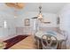 Dining room with hardwood floors and a round table at 9457 Heartwellville Ave, Englewood, FL 34224