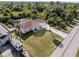 Aerial view of a single-story home with a large yard and RV parking at 9487 Prospect Ave, Englewood, FL 34224