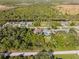 Wide aerial view of property and surrounding conservation area at 9487 Prospect Ave, Englewood, FL 34224