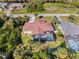 Aerial view of single Gathering home with pool and surrounding landscape at 9487 Prospect Ave, Englewood, FL 34224