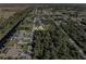 Aerial view of a canal front property with a spacious backyard at 9487 Prospect Ave, Englewood, FL 34224