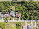 High-angle view of house and neighborhood with surrounding greenery at 9487 Prospect Ave, Englewood, FL 34224