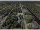 Aerial view of canal front home with large backyard and lush landscaping at 9487 Prospect Ave, Englewood, FL 34224