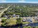 Aerial view showing home's location in a residential neighborhood near water at 9487 Prospect Ave, Englewood, FL 34224