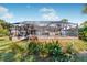 Home features a large backyard with a screened pool and patio at 9487 Prospect Ave, Englewood, FL 34224