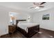 Comfortable bedroom with a queen bed and dark wood dresser at 9487 Prospect Ave, Englewood, FL 34224