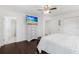 Bright bedroom with double bed, dresser, and ensuite bathroom access at 9487 Prospect Ave, Englewood, FL 34224