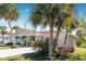 Beautiful home with lush landscaping and palm trees at 9487 Prospect Ave, Englewood, FL 34224