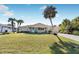 Charming single story home with a well-manicured lawn at 9487 Prospect Ave, Englewood, FL 34224