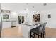 Spacious kitchen boasts white cabinets, granite countertops and island at 9487 Prospect Ave, Englewood, FL 34224
