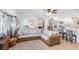 Open living space with sectional sofa, and views of kitchen and bedroom at 9487 Prospect Ave, Englewood, FL 34224