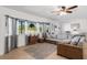 Bright and airy living room with sectional sofa and bay window at 9487 Prospect Ave, Englewood, FL 34224