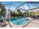 Relax by the refreshing pool, under the screened enclosure at 9487 Prospect Ave, Englewood, FL 34224