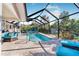 Inviting pool and patio with comfortable seating and a screened enclosure at 9487 Prospect Ave, Englewood, FL 34224