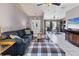 Living room with gray sofa, coffee table, and built-in shelving at 3258 N Biscayne Dr, North Port, FL 34291