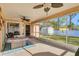 Screened porch with view of backyard and shed at 3258 N Biscayne Dr, North Port, FL 34291