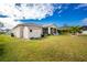 Large backyard with shed and lush grass at 10430 Chablis Ave, Englewood, FL 34224