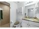 Bathroom boasts granite countertop and shower stall at 10430 Chablis Ave, Englewood, FL 34224