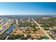 Aerial view showcasing a single-Gathering house nestled in a residential neighborhood at 109 Bonita Dr, Rotonda West, FL 33947