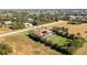 Aerial view of a single-Gathering home with a pool and solar panels at 109 Bonita Dr, Rotonda West, FL 33947