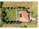 Overhead view showcasing a house, pool, and spacious grassy yard at 109 Bonita Dr, Rotonda West, FL 33947