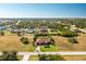 Aerial view of a single-Gathering home with a large backyard and pool at 109 Bonita Dr, Rotonda West, FL 33947