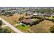 Aerial view of a single Gathering home on a large lot with a canal nearby at 109 Bonita Dr, Rotonda West, FL 33947