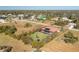 Aerial view of a single-Gathering home with a pool and solar panels at 109 Bonita Dr, Rotonda West, FL 33947