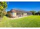 Screened pool and patio overlooking the lawn at 109 Bonita Dr, Rotonda West, FL 33947