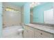 Bathroom with granite countertop vanity and bathtub at 109 Bonita Dr, Rotonda West, FL 33947