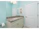 Bathroom featuring granite vanity and updated fixtures at 109 Bonita Dr, Rotonda West, FL 33947