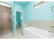 Bathroom with a shower, toilet and a large garden bathtub at 109 Bonita Dr, Rotonda West, FL 33947