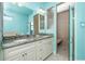 Bathroom with double vanity, granite countertop, and large walk-in shower at 109 Bonita Dr, Rotonda West, FL 33947