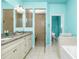 Spa-like bathroom with a large walk-in shower, soaking tub, and double vanity at 109 Bonita Dr, Rotonda West, FL 33947