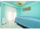 Light and airy bedroom with ceiling fan and access to backyard at 109 Bonita Dr, Rotonda West, FL 33947