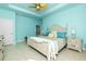 Main bedroom with a king-size bed, and light blue walls, and access to the bathroom at 109 Bonita Dr, Rotonda West, FL 33947