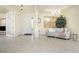 Bright and spacious entryway with tiled floors and a comfy couch at 109 Bonita Dr, Rotonda West, FL 33947
