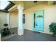 Inviting entryway with a light teal door and decorative wreath at 109 Bonita Dr, Rotonda West, FL 33947