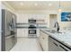 Modern kitchen with stainless steel appliances and granite countertops at 109 Bonita Dr, Rotonda West, FL 33947
