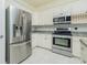 Modern kitchen with stainless steel appliances and granite countertops at 109 Bonita Dr, Rotonda West, FL 33947