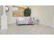 Comfortable living area featuring a light gray tufted sofa at 109 Bonita Dr, Rotonda West, FL 33947