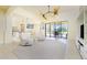 Open concept living room with access to the pool area at 109 Bonita Dr, Rotonda West, FL 33947