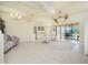 Open living space with a view of the kitchen and outdoor patio at 109 Bonita Dr, Rotonda West, FL 33947