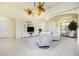 Bright and airy living room with comfortable seating and a large TV at 109 Bonita Dr, Rotonda West, FL 33947